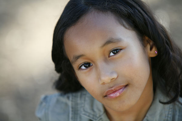 Headshots of comedian, actress Syd the Kid, Sydney Park looks up at the camera in the Los Angeles area.