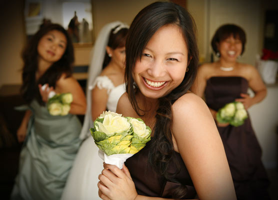 Bridesmaid getting sassy with the camera before the wedding ceremony with a bouquet of flowers in Montecito, Santa Barbara.