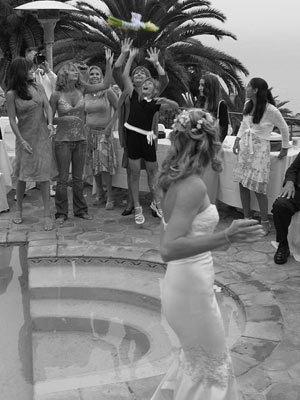 Bride tosses her bouquet at a wedding reception in Palos Verdes, will the little girl catch it?