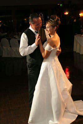 Classic photojournalistic shot of the father and daugher dance.
