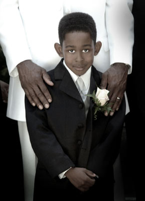 The ring bearer gets a quick candid shot with his dad at this Los Angeles wedding.